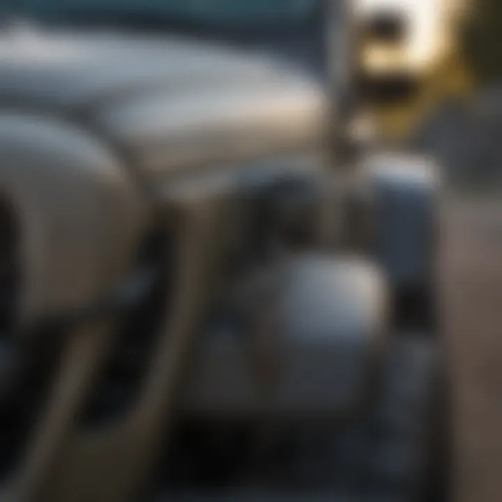 Comparison of standard vs locking hood latch for Jeep