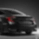 Sleek profile of the all-black Honda Civic Sport showcasing its aerodynamic design.