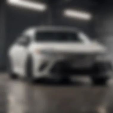 Sleek front view of the all white Toyota Camry showcasing its elegant design.