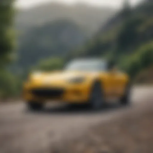 Vibrant yellow Mazda Miata parked against a scenic backdrop