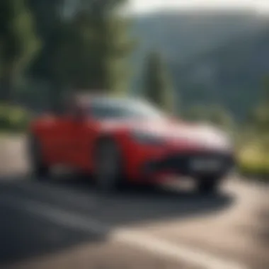 Sporty coupe driving along a scenic road