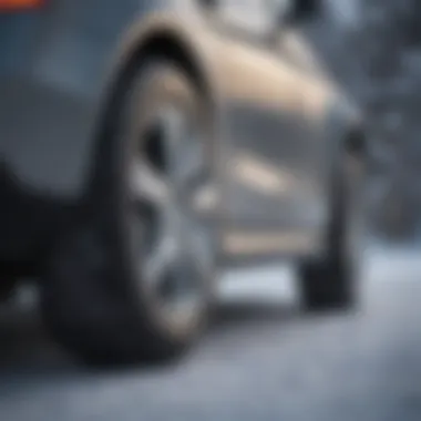 Close-up of a Mercedes vehicle fitted with premium snow tires on a snowy road.