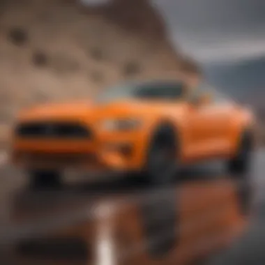 Dynamic performance shot of the 2017 Orange Mustang on a winding road.