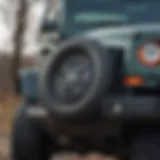 Jeep Wrangler with spare tire cover featuring a backup camera