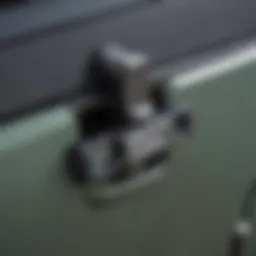 Close-up of a locking hood latch on Jeep Wrangler JK