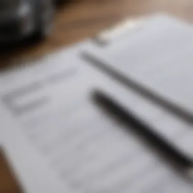 A close-up of a clipboard displaying leasing agreements and insurance documents.