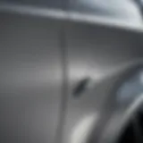 Close-up view of a car dent on a rear fender
