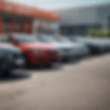 A diverse range of used cars displayed in a dealership lot.