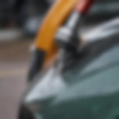 Close-up of a pressure washer nozzle aimed at a car's surface