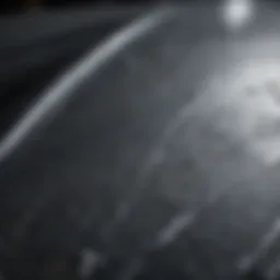 Close-up view of car paint scratches on a vehicle surface