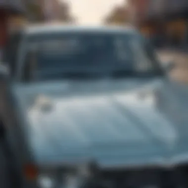 A vehicle parked with a prominent windshield crack visible