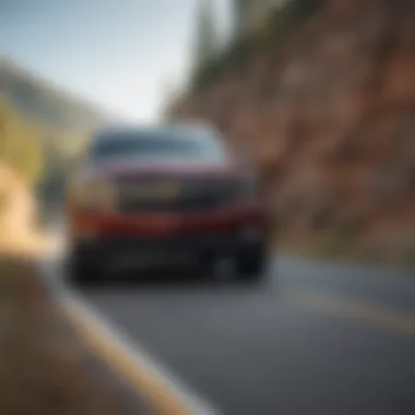 Chevy Tahoe Hybrid driving on a scenic road illustrating performance