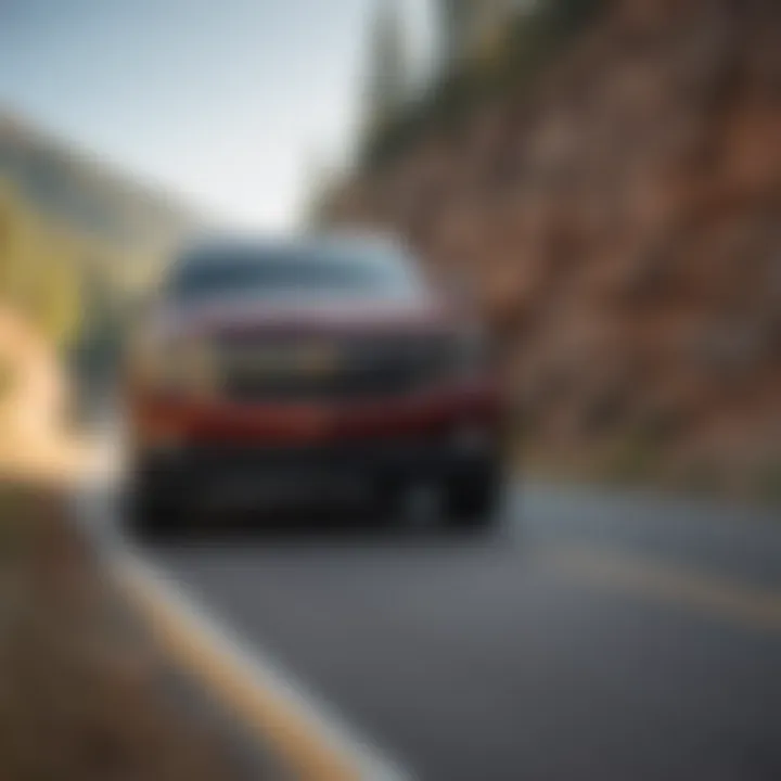 Chevy Tahoe Hybrid driving on a scenic road illustrating performance